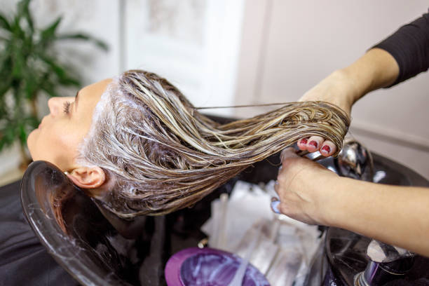 istock Washing freshly dyed hair 1299850390