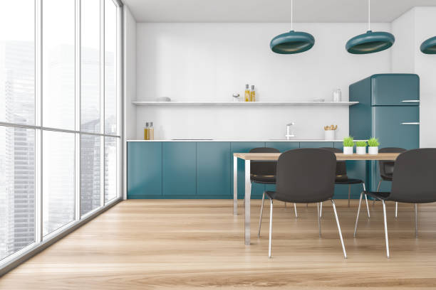 istock Blue kitchen set with fridge, chairs and dining table near large window 1299851717