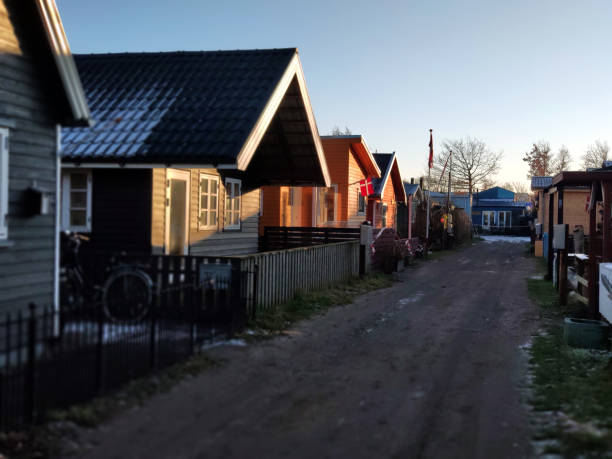 Small wooden houses in a community living simple and next to the waterfront