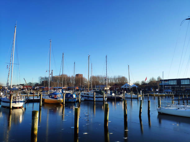 istock Sail boats in a quiet Marina on sunny winter day 1299851873