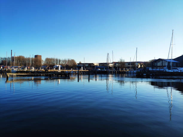 istock Sail boats in a quiet Marina on sunny winter day 1299851936