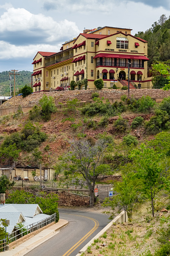 Jerome, Arizona USA - April 27, 2017: Cityscape view of the Jerome Grand Hotel, famously known for its haunted ghosts, in this popular small mountain town located in Yavapai County in the Verde Valley.