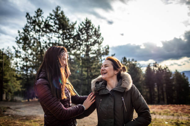 istock Two women relaxing in nature 1299852797