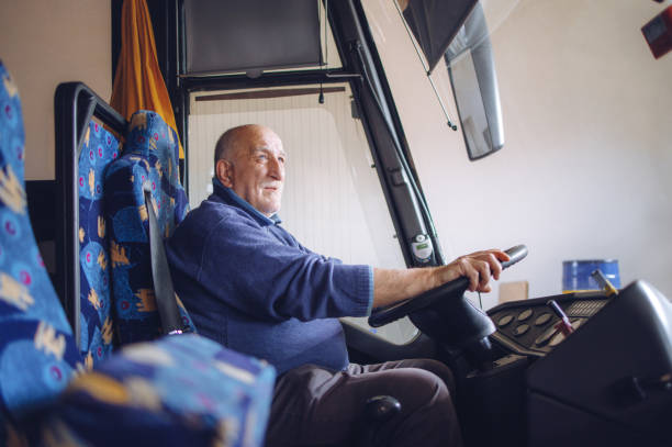 istock Senior male driver driving bus 1299853959