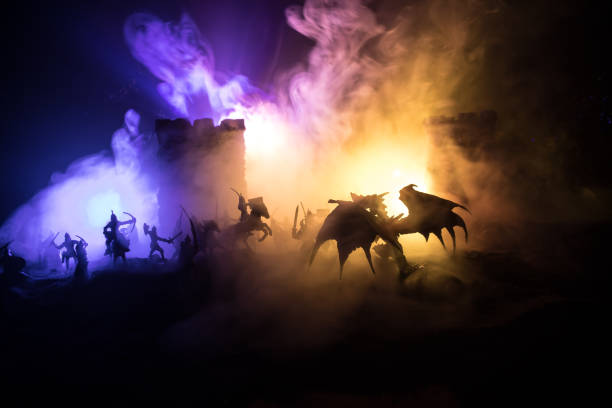 istock Battle between dragon and heroic soldiers. Creative table decoration. Selective focus 1299855082