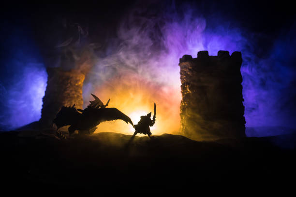 istock Battle between dragon and heroic soldiers. Creative table decoration. Selective focus 1299855118