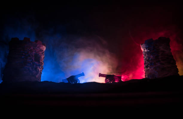 istock Medieval battle scene. Silhouettes of figures as separate objects, fight between warriors at night. Creative artwork decoration. Foggy background. 1299855142