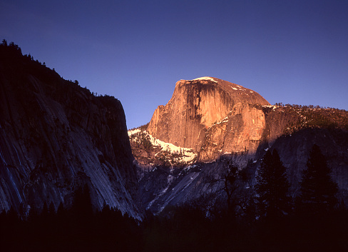 Winter view of Half Dome at sunset.

Taken in Yosemite National Park, California, USA.