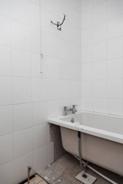 istock small bathroom renovation and installation tiles after grouting 1299856712