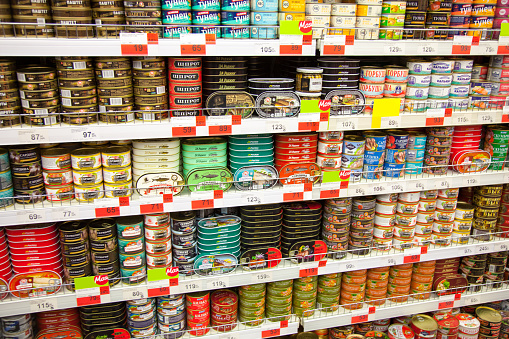 Kaliningrad, Russia - January 31, 2021: Canned fish on supermarket shelves.