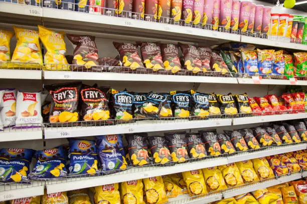 Kaliningrad, Russia - January 31, 2021: Chips on supermarket shelves.