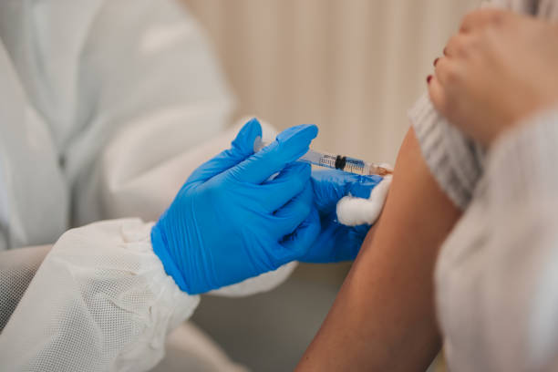 istock Young female patient at Covid19 vaccination 1299863497