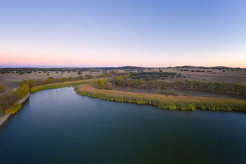 Lake drone aerial view at sunset in Alentejo, Portugal