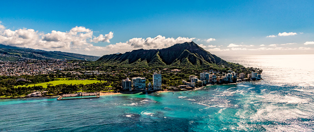 The majestic Diamond Head in the city of Honolulu, Hawaii shot from an altitude of about 800 feet over the Pacific Ocean.