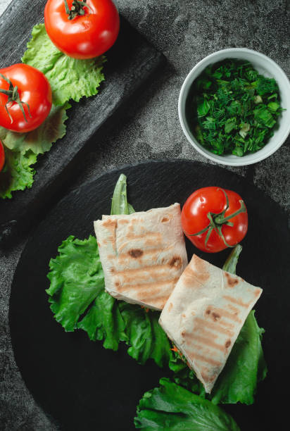 istock Homemade diet fresh shawarma with greens, chicken breast and tomatoes 1299865582