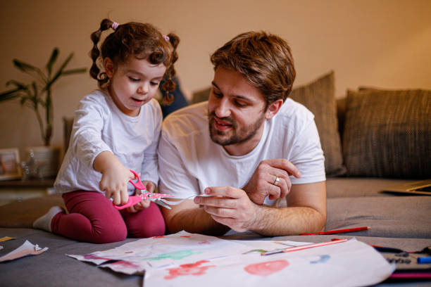 istock Father helping with new project stock photo 1299867364