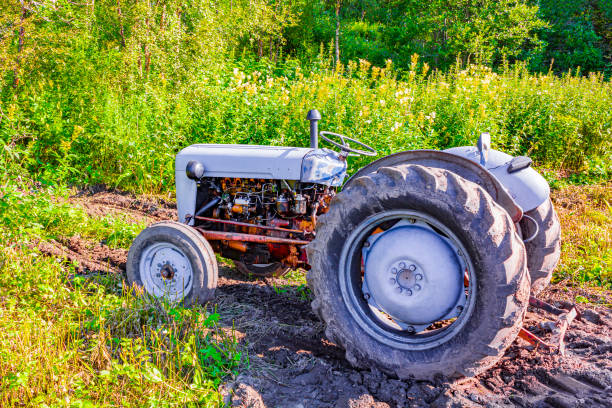 Tractor is stuck in the mud dirt in Vang i Valdres Norway.