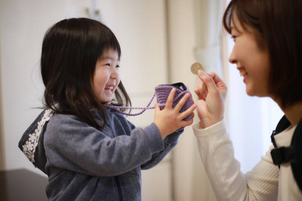 istock Girl getting pocket money 1299867493