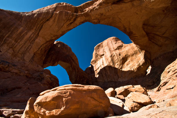 istock Double Arch Hiking Trail - Arches National Park, Utah 1299875692