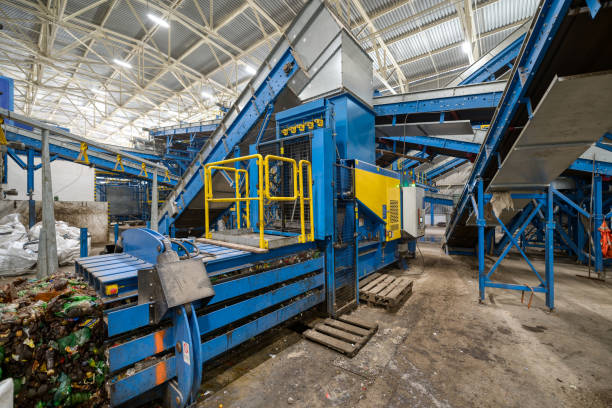 istock Household waste sorting and recycling plant. Press for pressing plastic bottles 1299880518