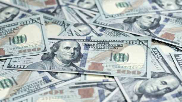 Closeup background of money banknote hundred dollars stock photo