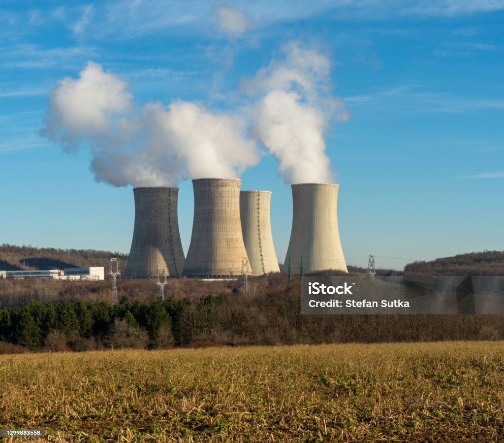 Cooling towers of nuclear power plant  with cloudy sky in the background. Nuclear power station. Atmosphere Stock Photo