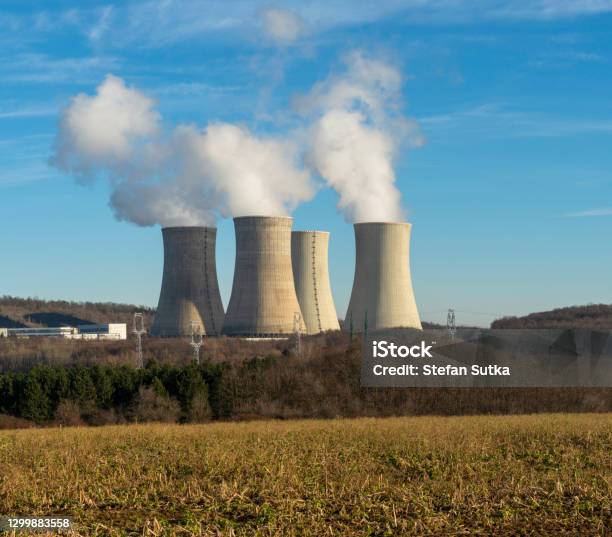 Cooling Towers Of Nuclear Power Plant With Cloudy Sky In The Background Nuclear Power Station Stock Photo - Download Image Now