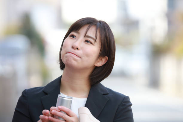 istock Female employee drinking a drink 1299883658