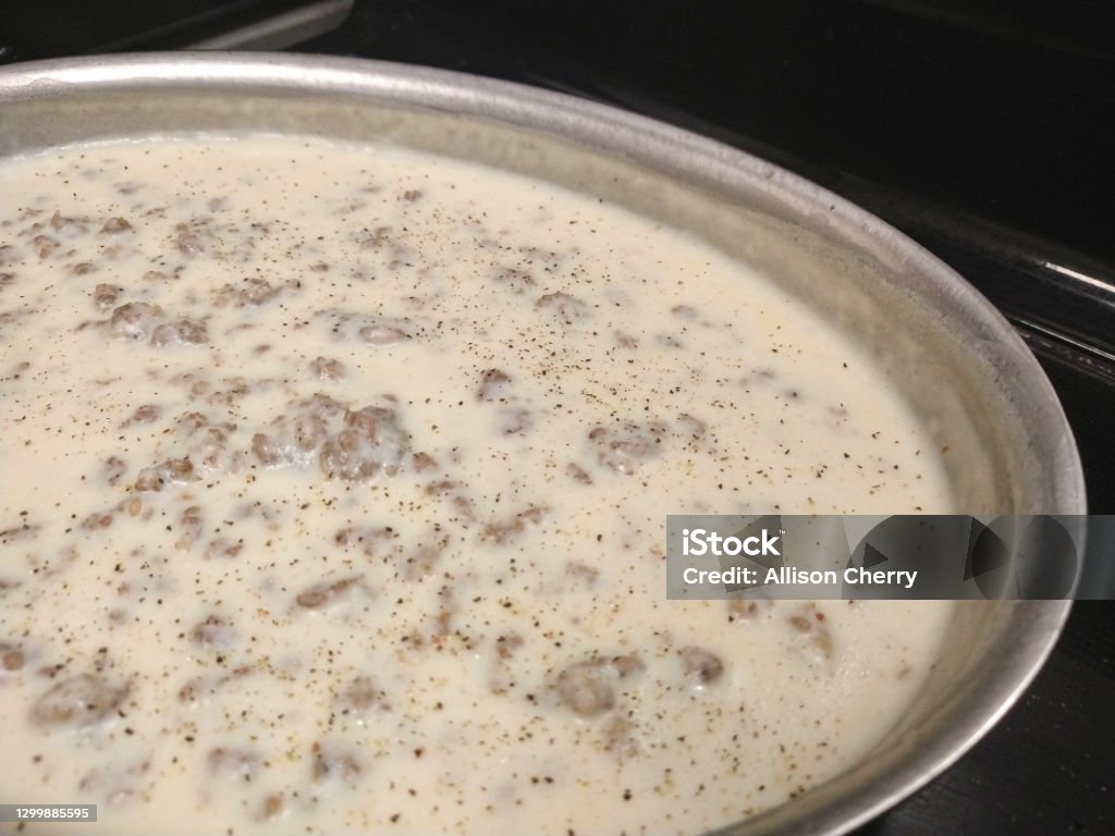 Sausage and gravy Brown sausage, add four tablespoons flour and three cups of milk, whisk over medium until thick. Breakfast Stock Photo