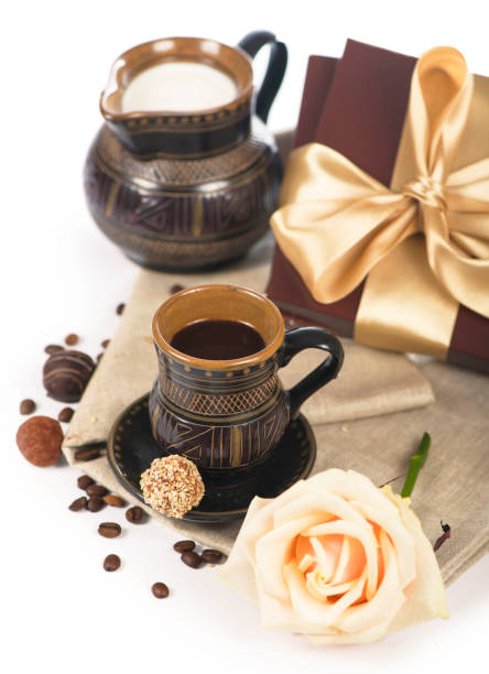istock old black pottery, coffee beans, candy and a cup of drink 1299886392