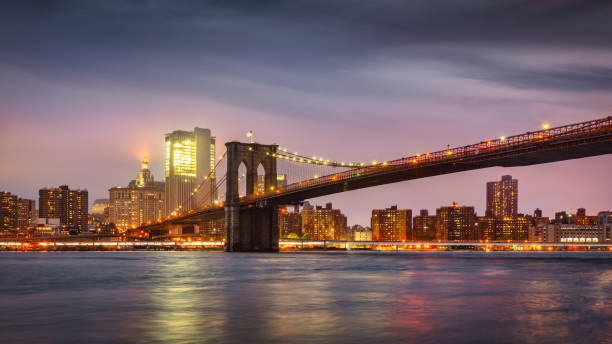 new york city brooklyn bridge at night east river twilight panorama nyc - connection usa brooklyn bridge business imagens e fotografias de stock