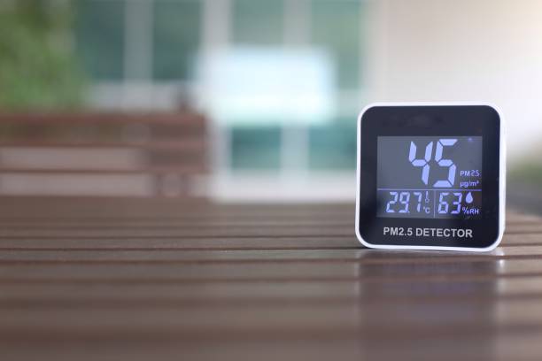 istock moderately high amount of 2.5 micron particulate matter air pollution. sensor detect harmful invisible dust in the air. poor unhealthy living condition. mobile device place on outdoor table. 1299887956