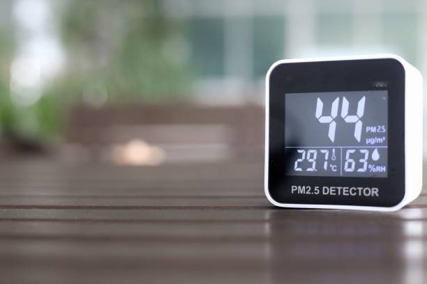 istock moderately high amount of 2.5 micron particulate matter air pollution. sensor detect harmful invisible dust in the air. poor unhealthy living condition. mobile device place on outdoor table. 1299887967