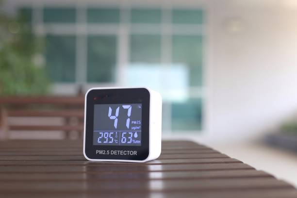 istock moderately high amount of 2.5 micron particulate matter air pollution. sensor detect harmful invisible dust in the air. poor unhealthy living condition. mobile device place on outdoor table. 1299887968