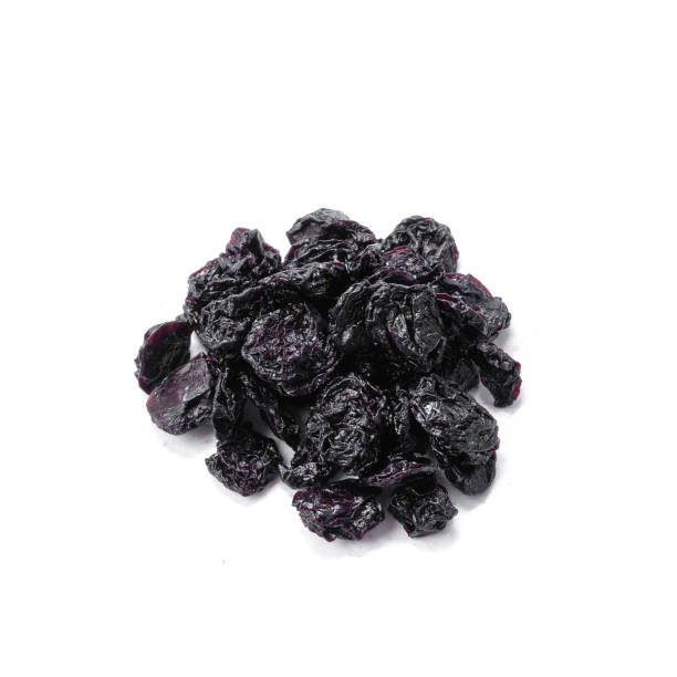 istock Dried cherries. White background. Isolated. Close-up. View from above. 1299890685