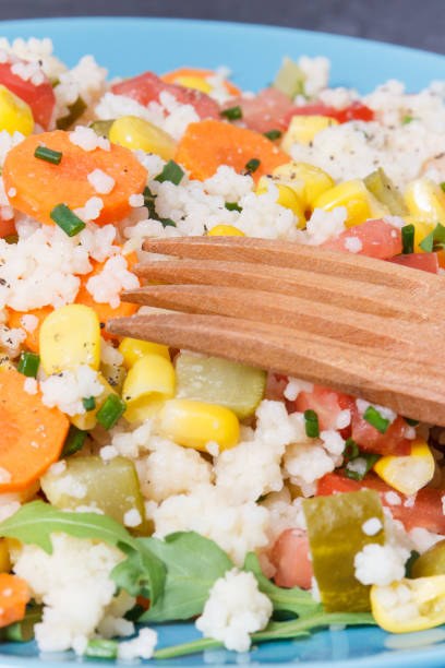 istock Fresh salad with couscous and vegetables as best nutritious food for dieting and slimming. Source vitamins and minerals 1299894630