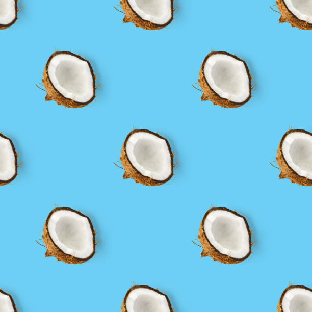 istock coconut Seamless pattern. Tropical abstract background with isolated Coconut on blue background. flat lay. 1299895443