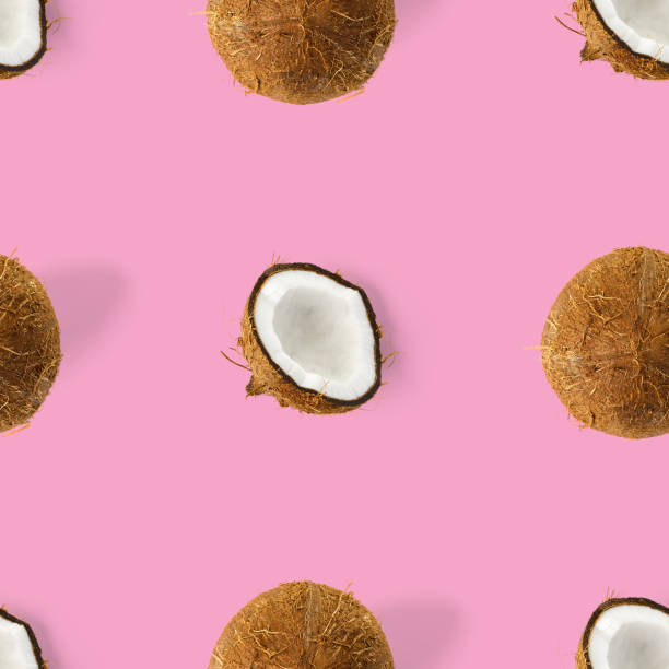 istock coconut Seamless pattern. Tropical abstract background with isolated Coconut on pink background. flat lay. 1299895520