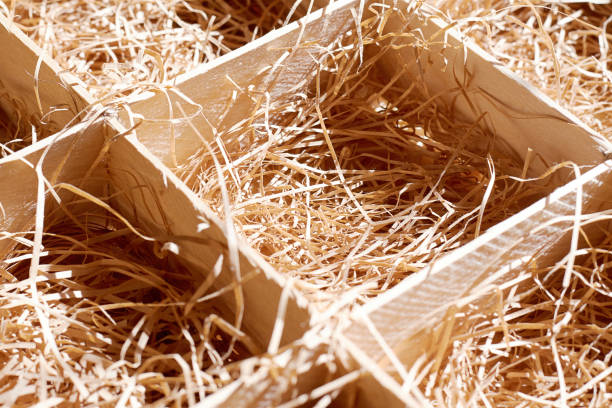 istock Wooden box with a straw for food and fragile objects. Background textures 1299896623