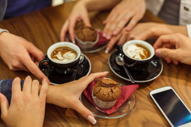 istock Small group of people enjoying coffee together 1299902234