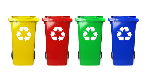 Four colorful recycle bins on white