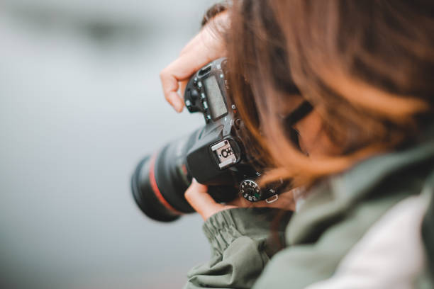 istock Cute Hispanic Photographer with Digital Camera 1299905242