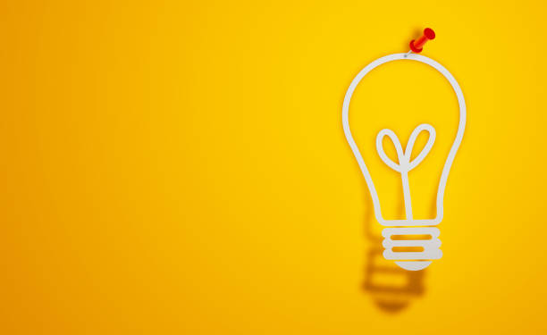 istock Pin Paper Light Bulb Symbol on Yellow Background 1299905436