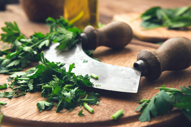 Fresh parsley on wooden table healthy eating close up. mezzaluna stock pictures, royalty-free photos & images