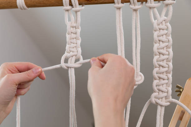 istock Women making macrame at home. Stay at home hobbies. 1299905634