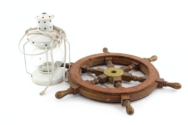 istock old lantern with steering wheel  isolated on white background 1299906609