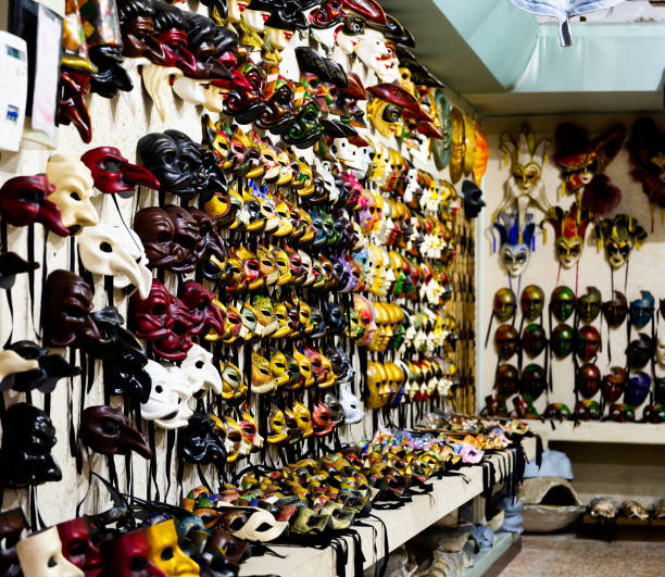 istock Traditional venician masks on shelves in souvenirs shop in Venice 1299906885