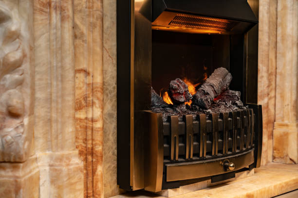 istock Wood logs burning in fireplace close up 1299907969