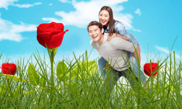 istock Asian man holding his girlfriend on his back 1299908511