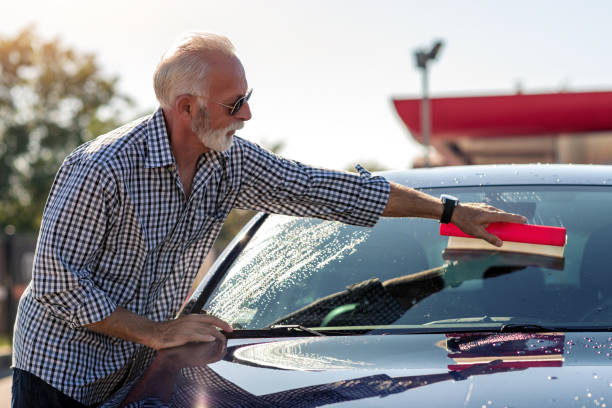istock Senior man cleaning his car 1299909187